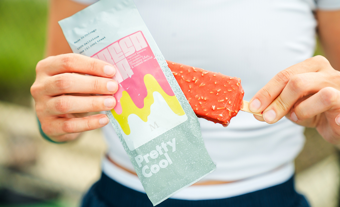 a person holding a popsicle