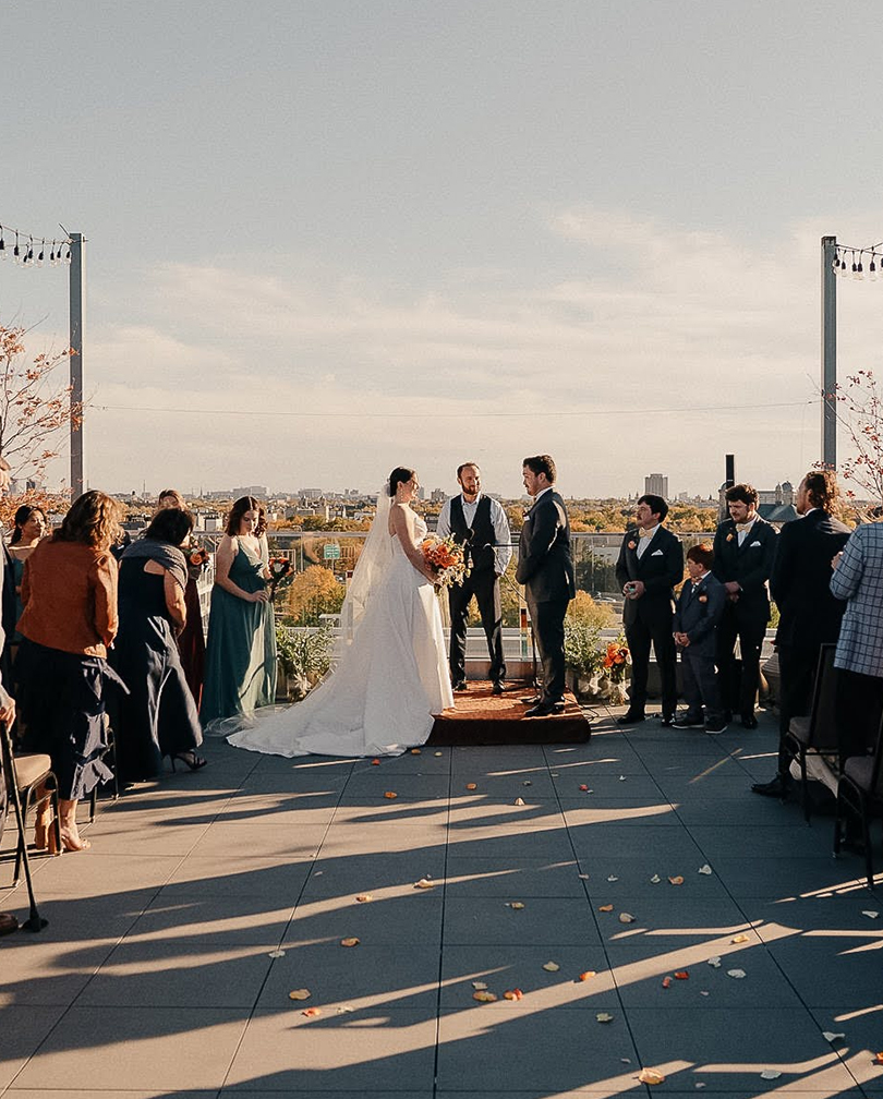 a bride and groom on a rooftop