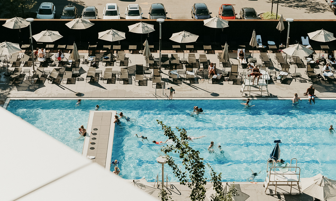 a pool with people swimming in it