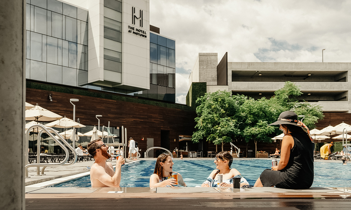 a group of people sitting in a pool
