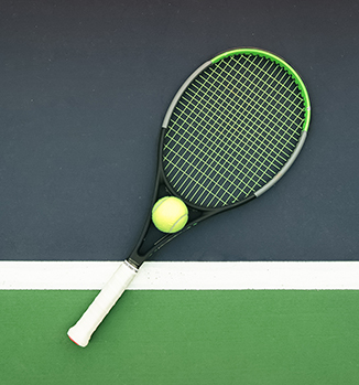 a tennis racket and ball on a court