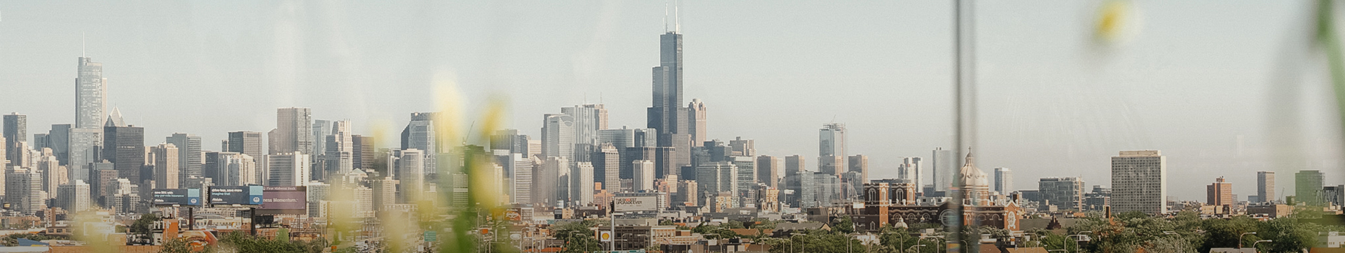 a city skyline with a tall skyscraper