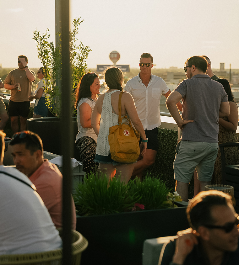 a group of people standing on a rooftop