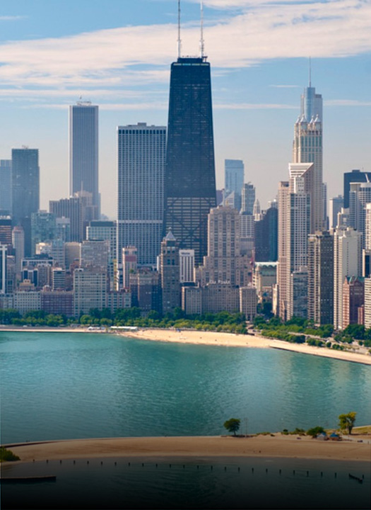 a city skyline with a body of water