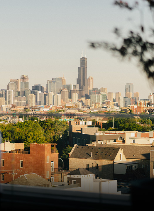 a city skyline with trees and buildings