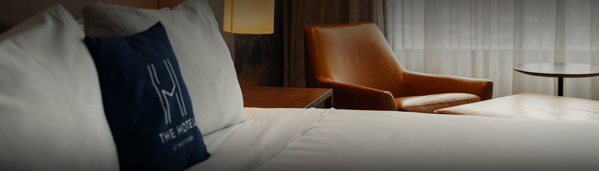 a chair next to a bed