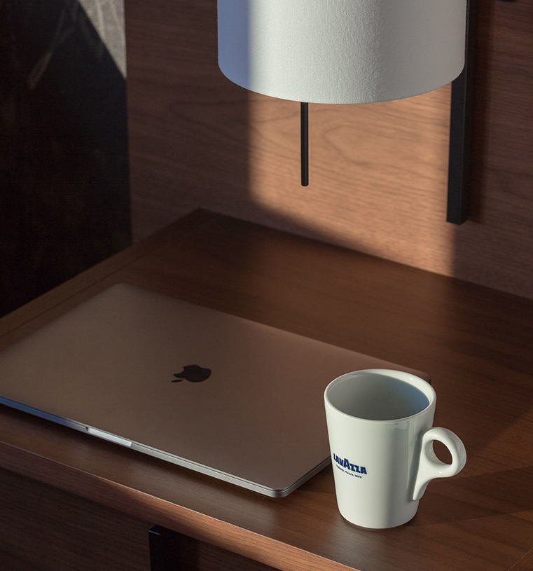 a laptop and a mug on a desk