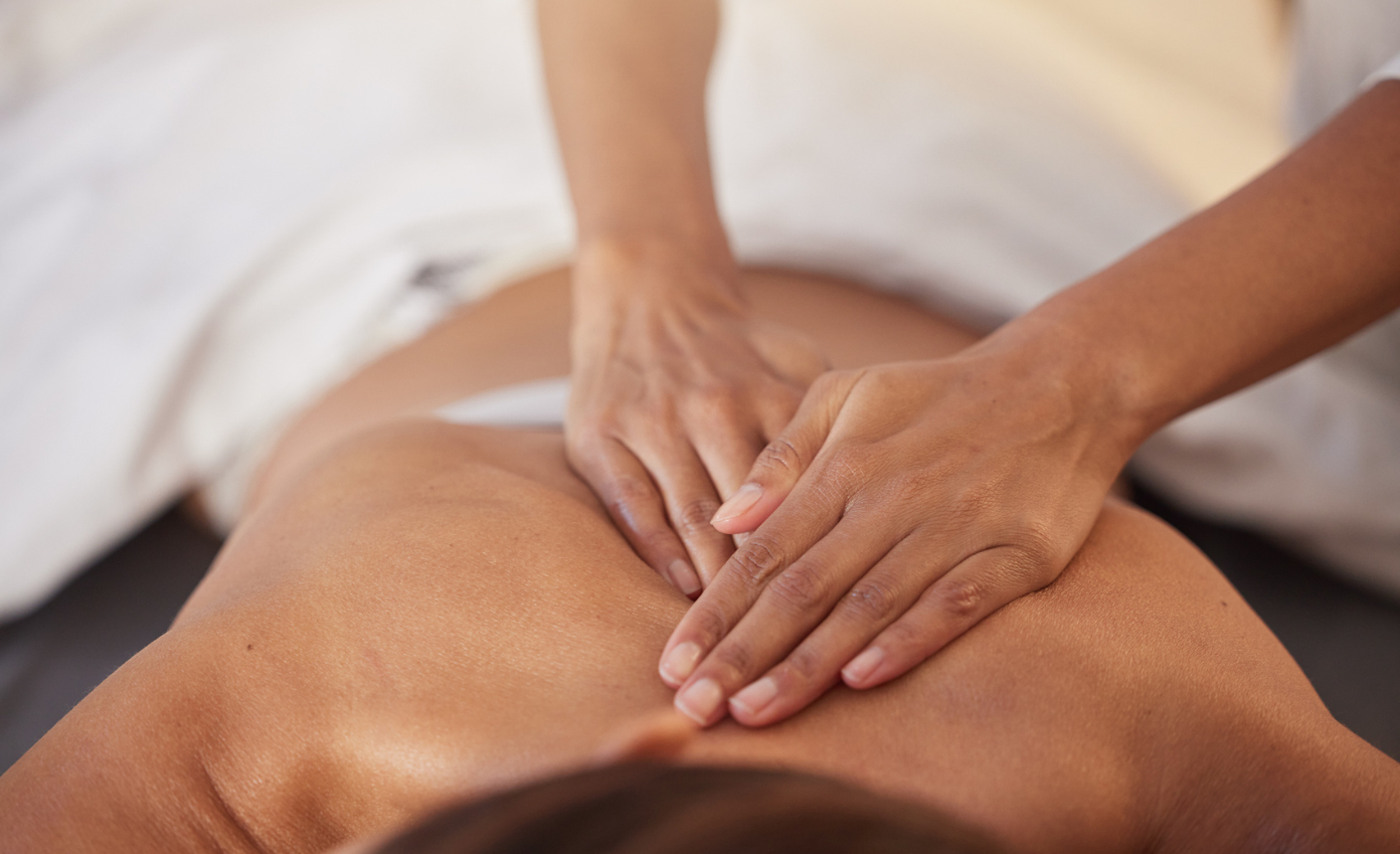 a person receiving a back massage