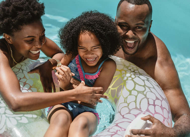 happy family enjoying the day at the pool