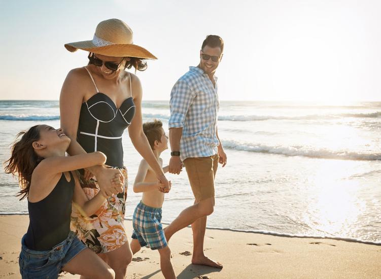 a family walking on the beach