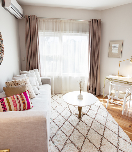 a living room with a couch and a table