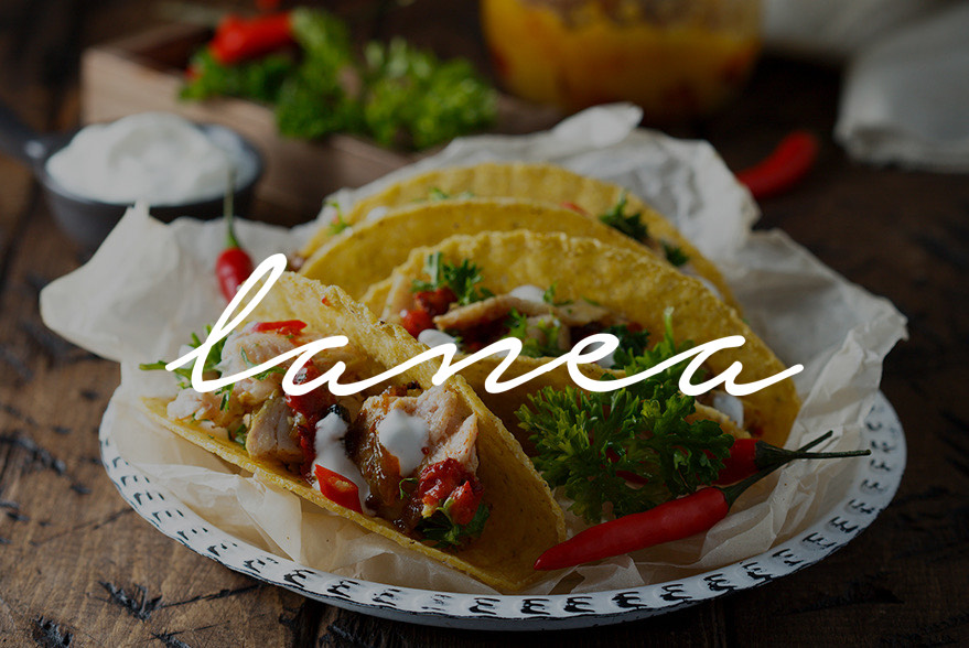 tacos on a plate with hard shell and lanea logo in cursive