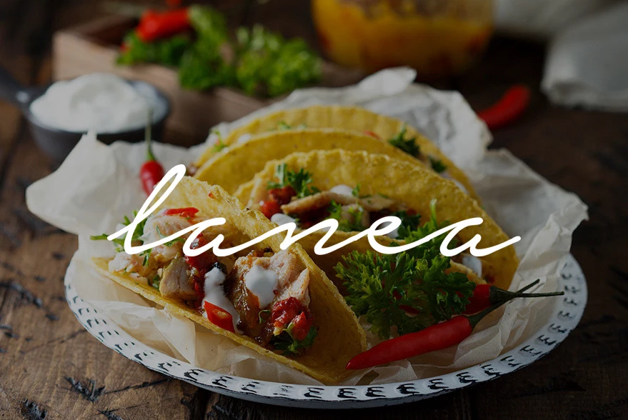 tacos on a plate with hard shell and lanea logo in cursive