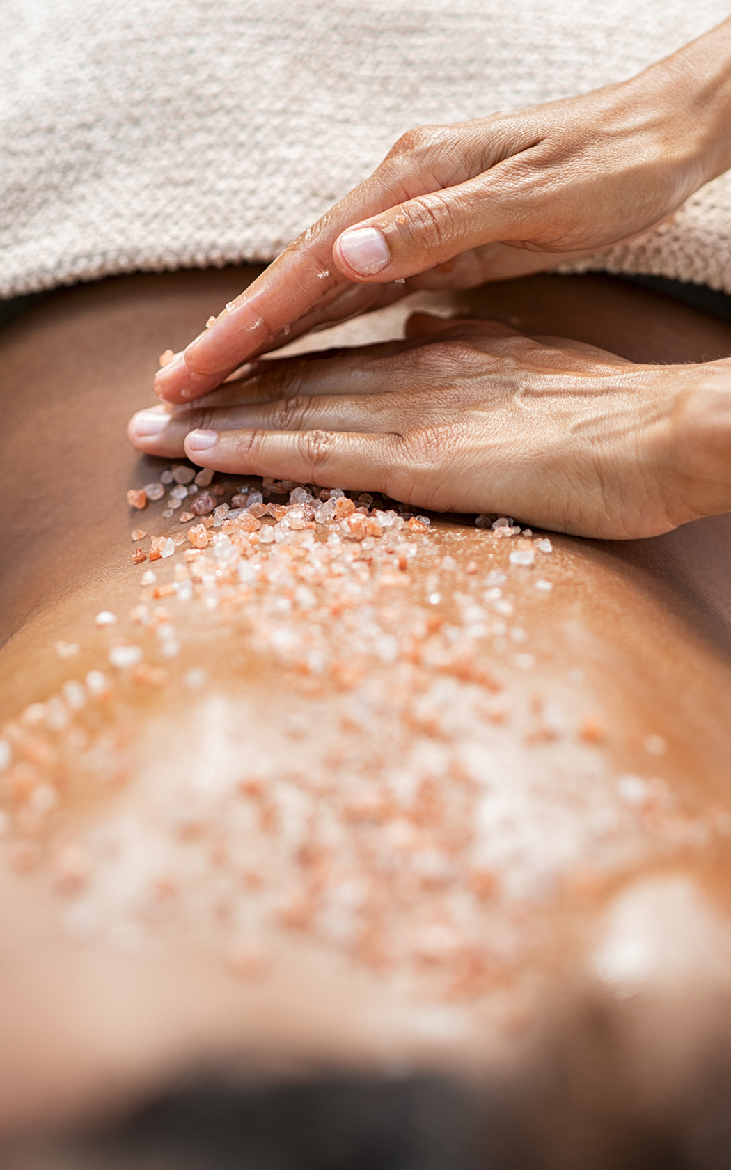 back of somebody with a marina salt on it as a body treatment