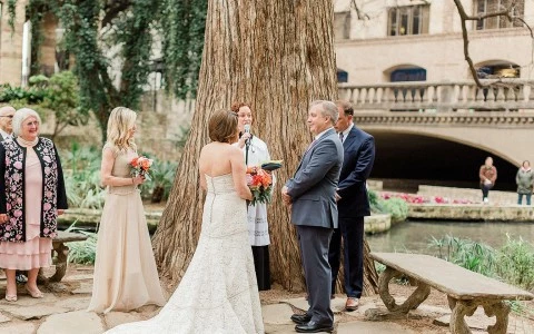 Couple listening to the priest in their wedding 