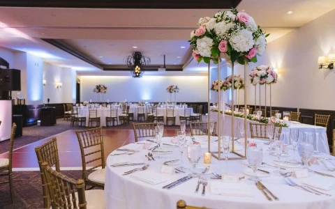 closeup view of empty saloon setup for a special occasion and boutique of flowers in the center of the table