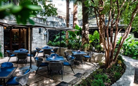 a patio with tables and chairs