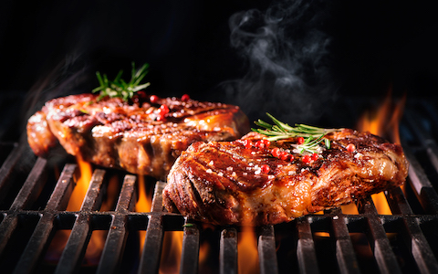 steaks on a grill