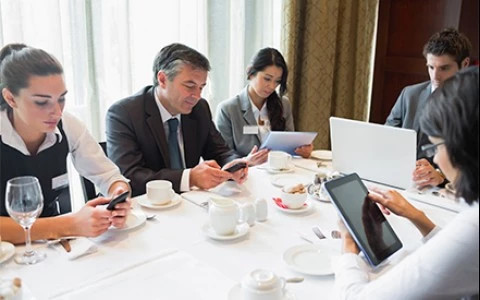 a group of people sitting around a table