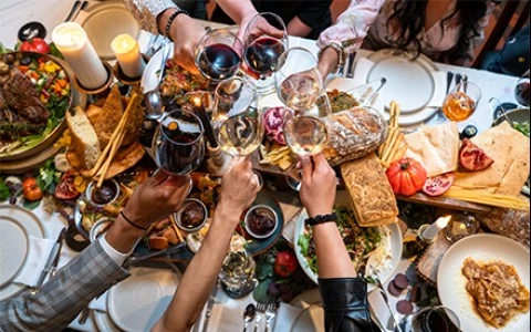 a group of people holding wine glasses