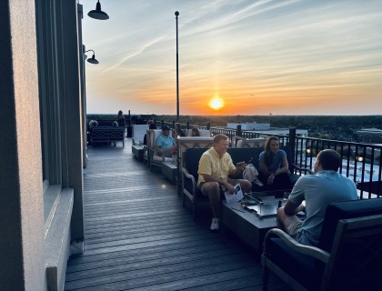 a group of people sitting on a deck