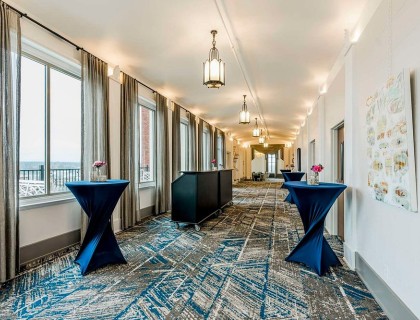 long hallway with tables and chairs