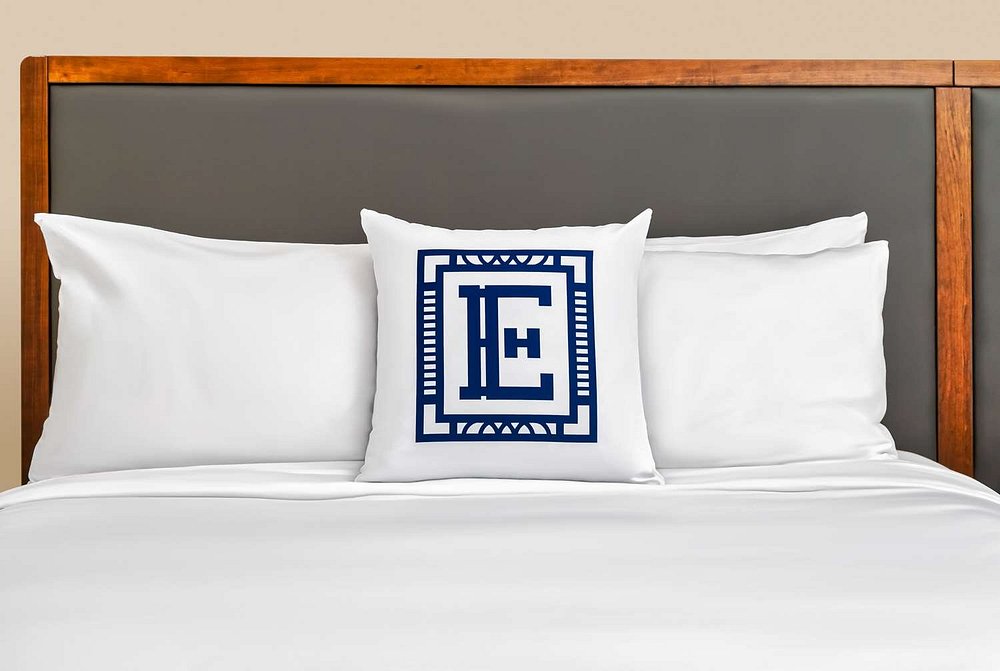 a white pillow on a bed