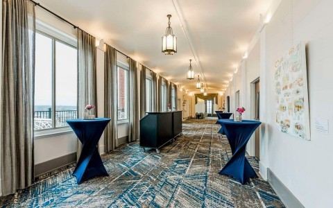 long hallway with tables and chairs