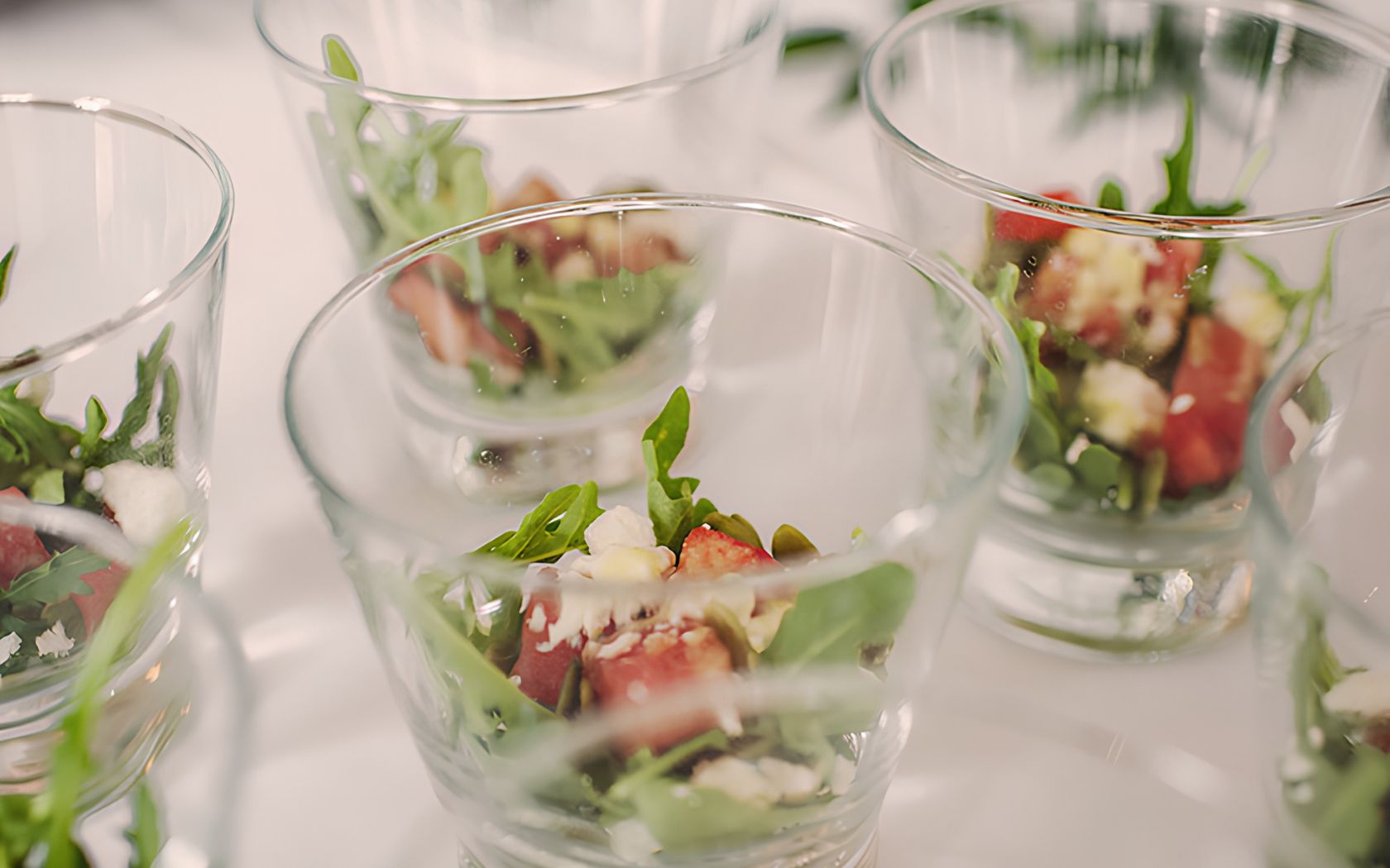 a group of glasses with food in them
