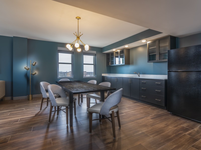 a kitchen with a table and chairs