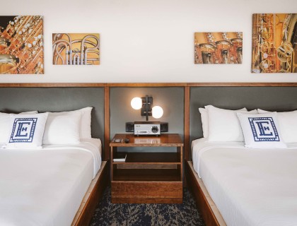 a room with two beds and a radio