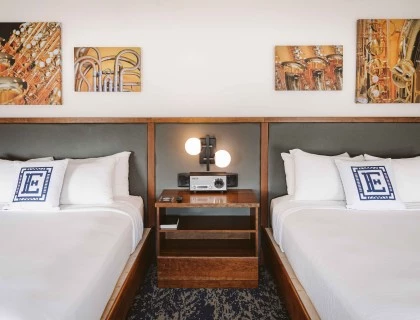a room with two beds and a radio