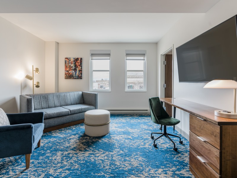 a room with a couch and a desk