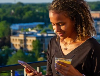 rooftop lifestyle girl with drink