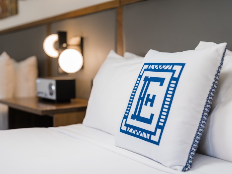 a white pillow with a letter on it
