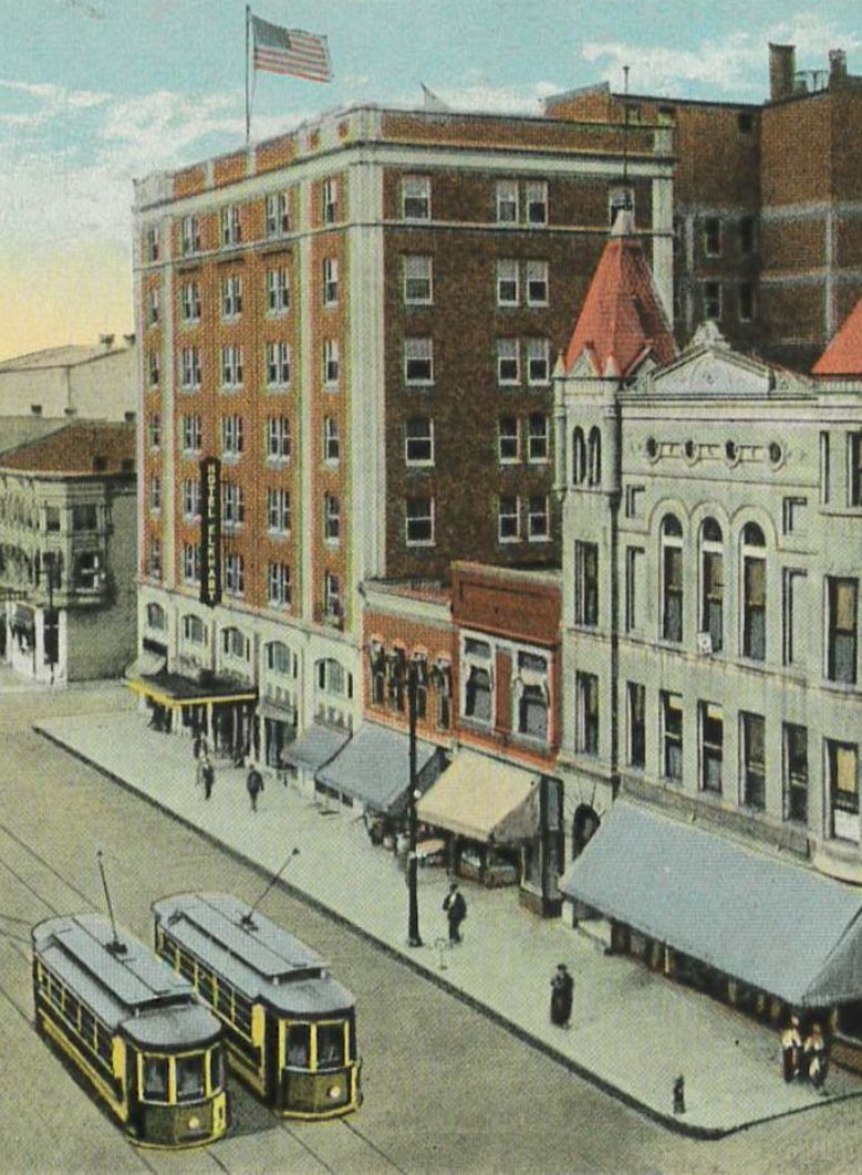 a street with trolleys and buildings