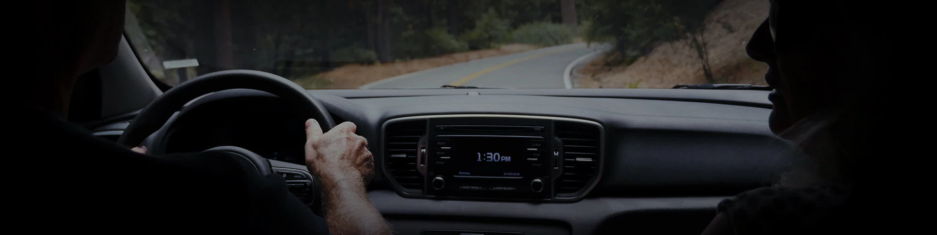 a view of a person driving a car