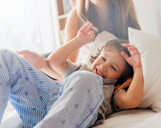 a woman playing with a young child
