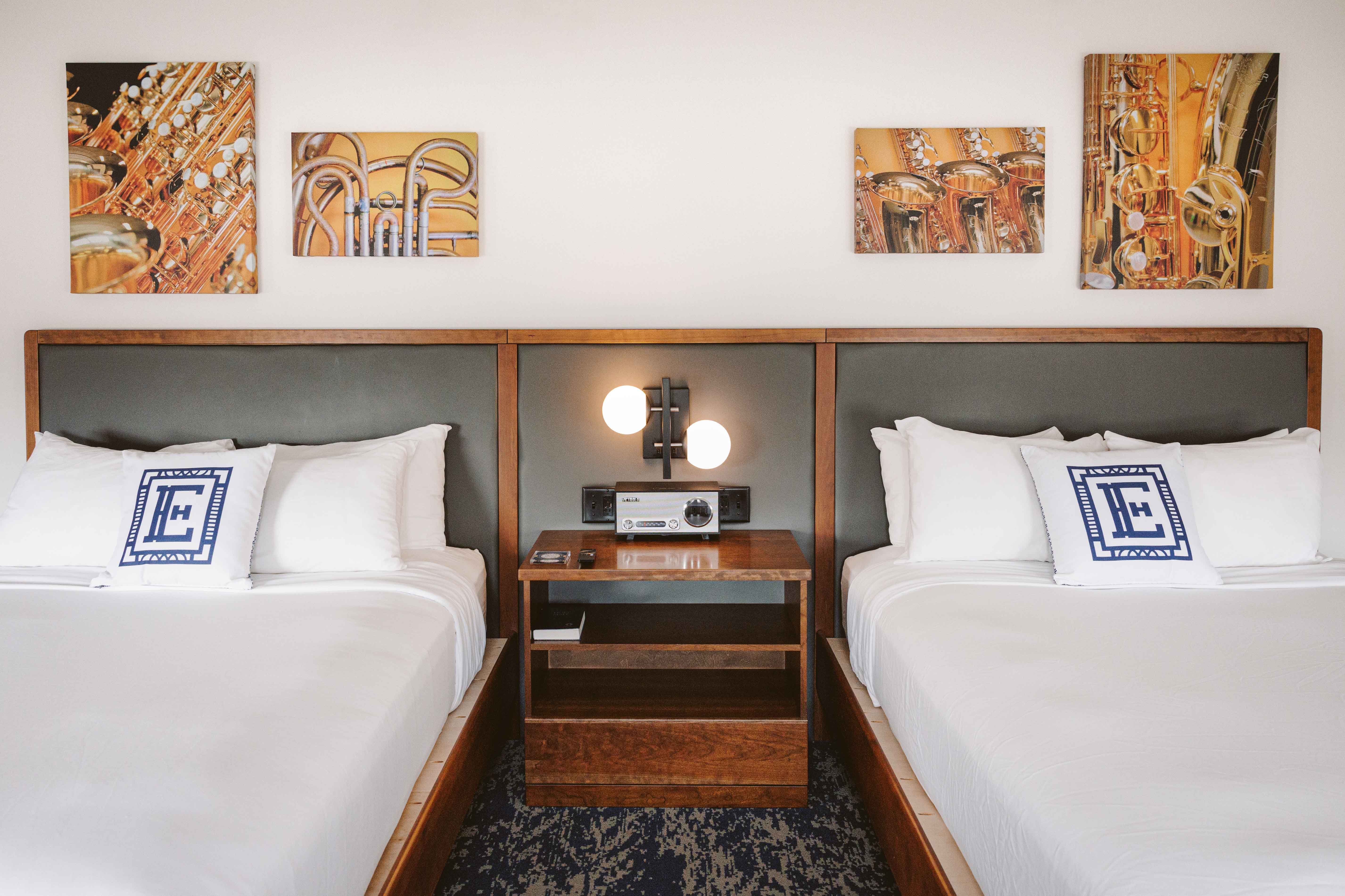 a room with two beds and a radio