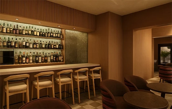 a room with a bar and chairs