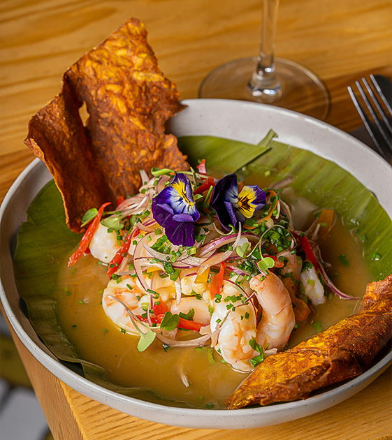 a bowl of food with flowers on it