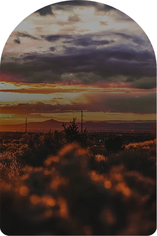 a sunset over a field