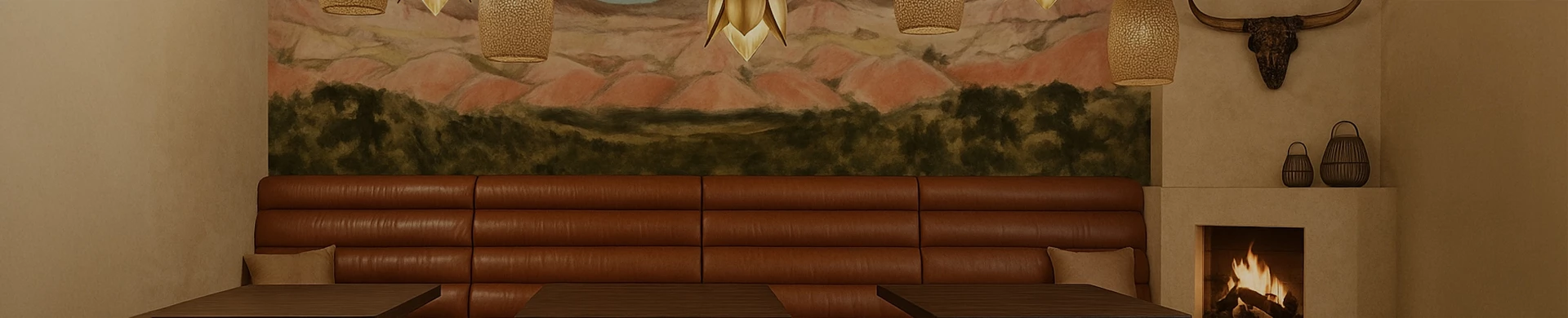 a brown couch with a lamp from the ceiling