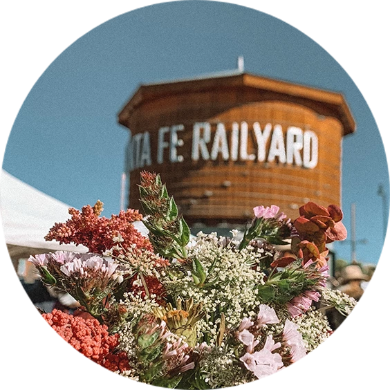 a bouquet of flowers in front of a round building