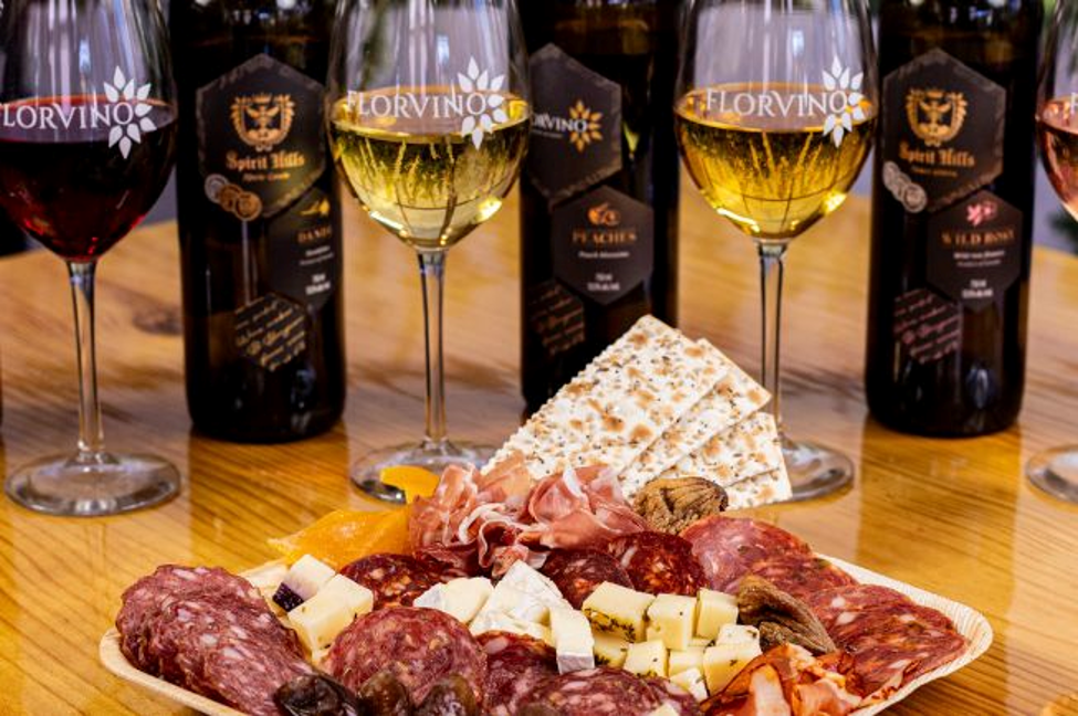 a plate of food and wine glasses
