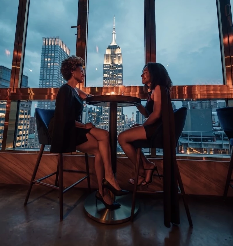 two women sitting at a table