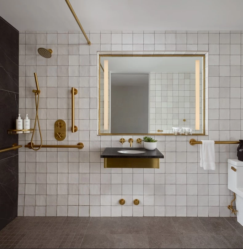 a bathroom with a sink and shower 