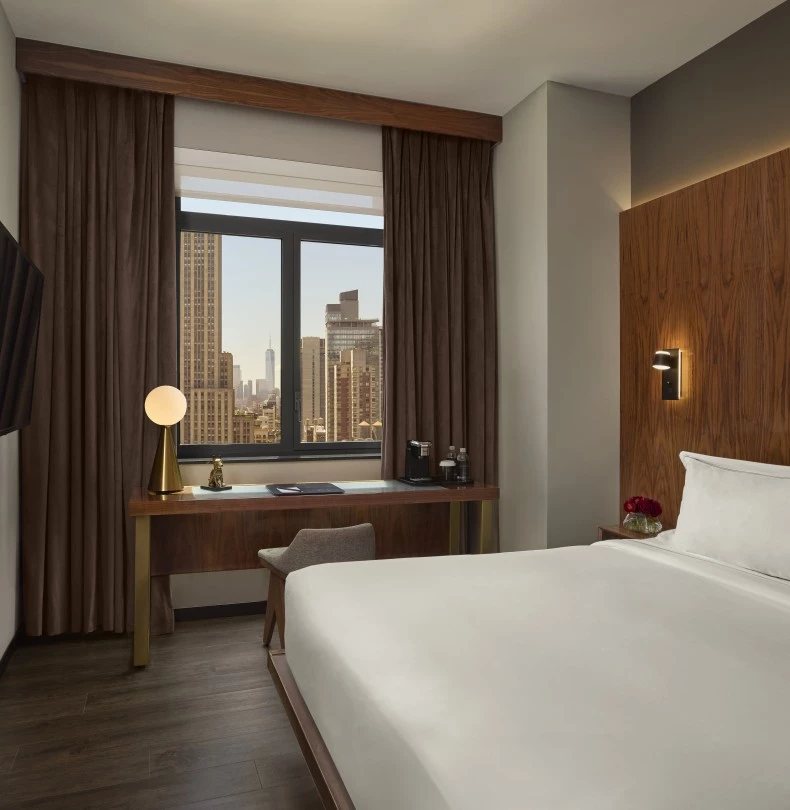 a room with a bed and a television 