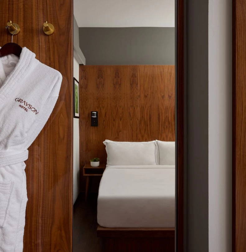 a white robe on a door 