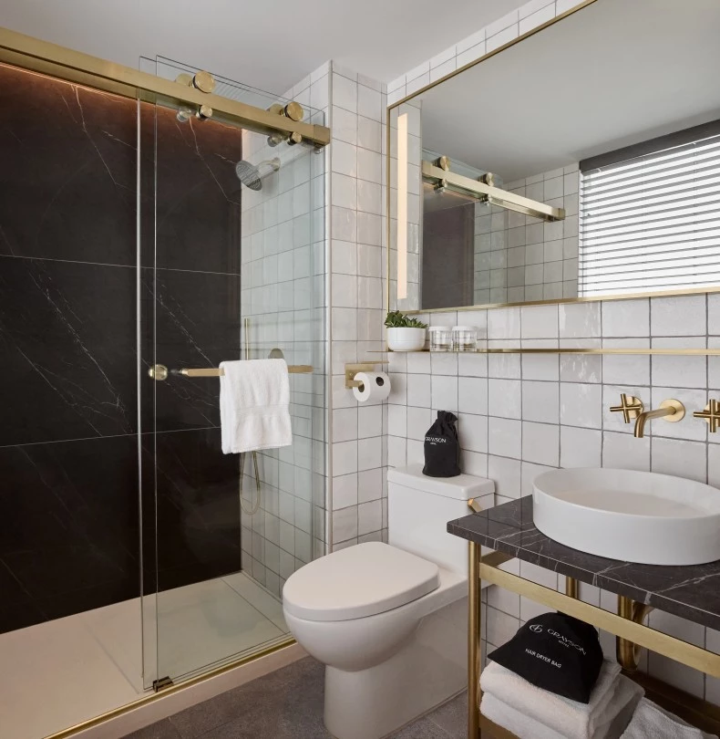 a bathroom with a shower and sink 